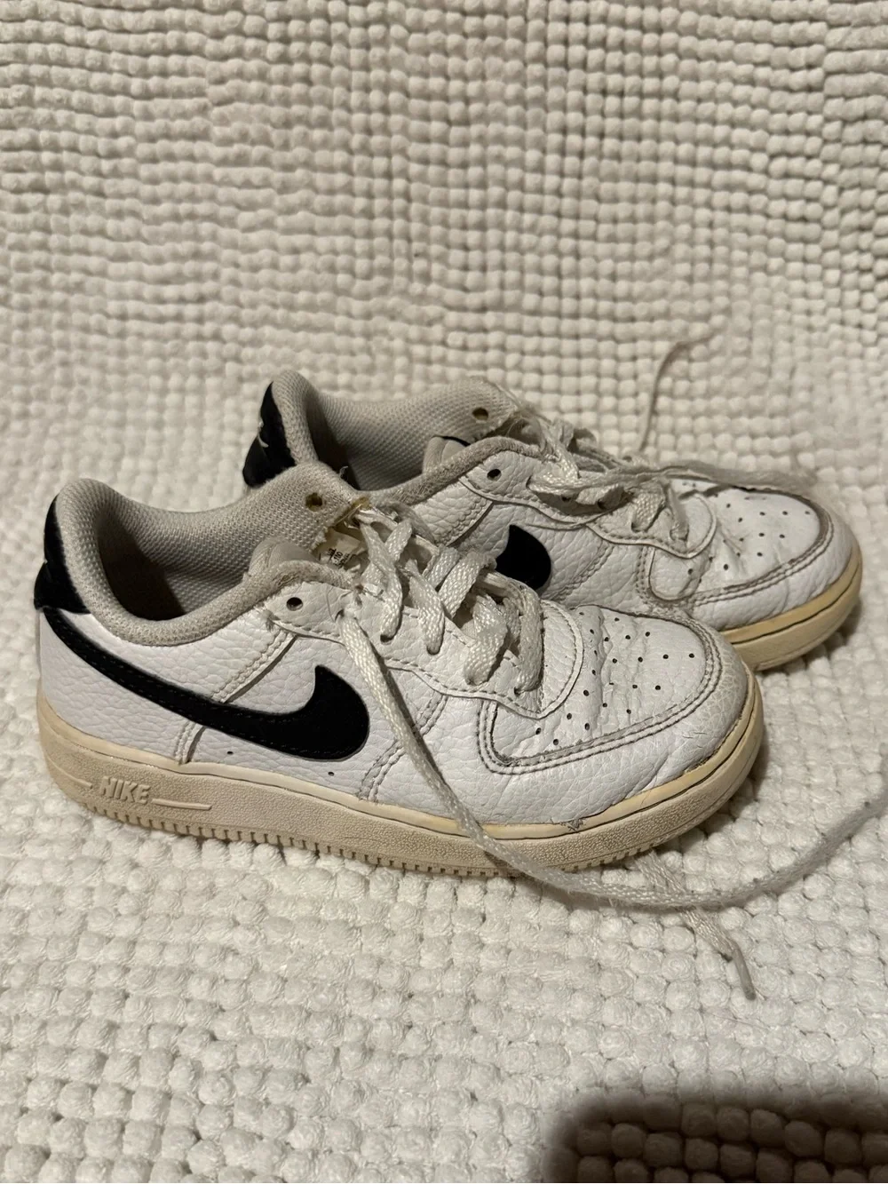 Nike Kids White Sneakers with Black Swoosh
